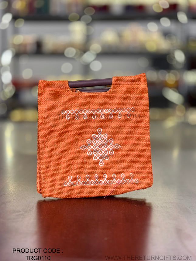 Orange Kolam Jute Bag with Wooden Handle Return Gift | TRG0110 | Handcrafted Kolam Print Jute Tote Under ₹100 | Traditional Wedding, Navratri & Pooja Favor Bag