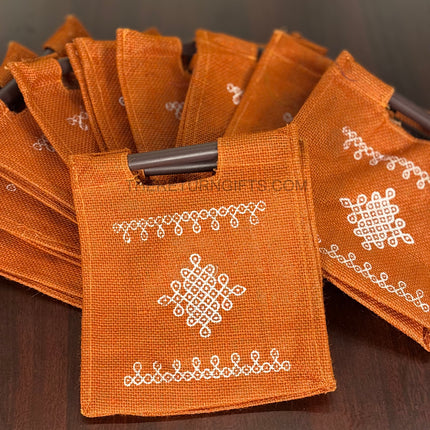Orange Kolam Jute Bag with Wooden Handle Return Gift | TRG0110 | Handcrafted Kolam Print Jute Tote Under ₹100 | Traditional Wedding, Navratri & Pooja Favor Bag
