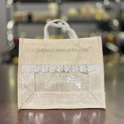 Beige Medium Jute Bag with Transparent Window | TRG0064 | Medium Jute Gift Bag with White Lace Handle | Eco‑Friendly Wedding & Housewarming Favor Under ₹150